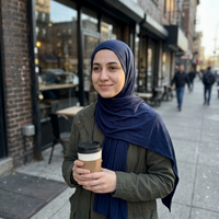 Instant Jersey Hijab in Navy, outside a café